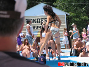 18 year old female Doris G slips off her underwear to pose naked on her bed